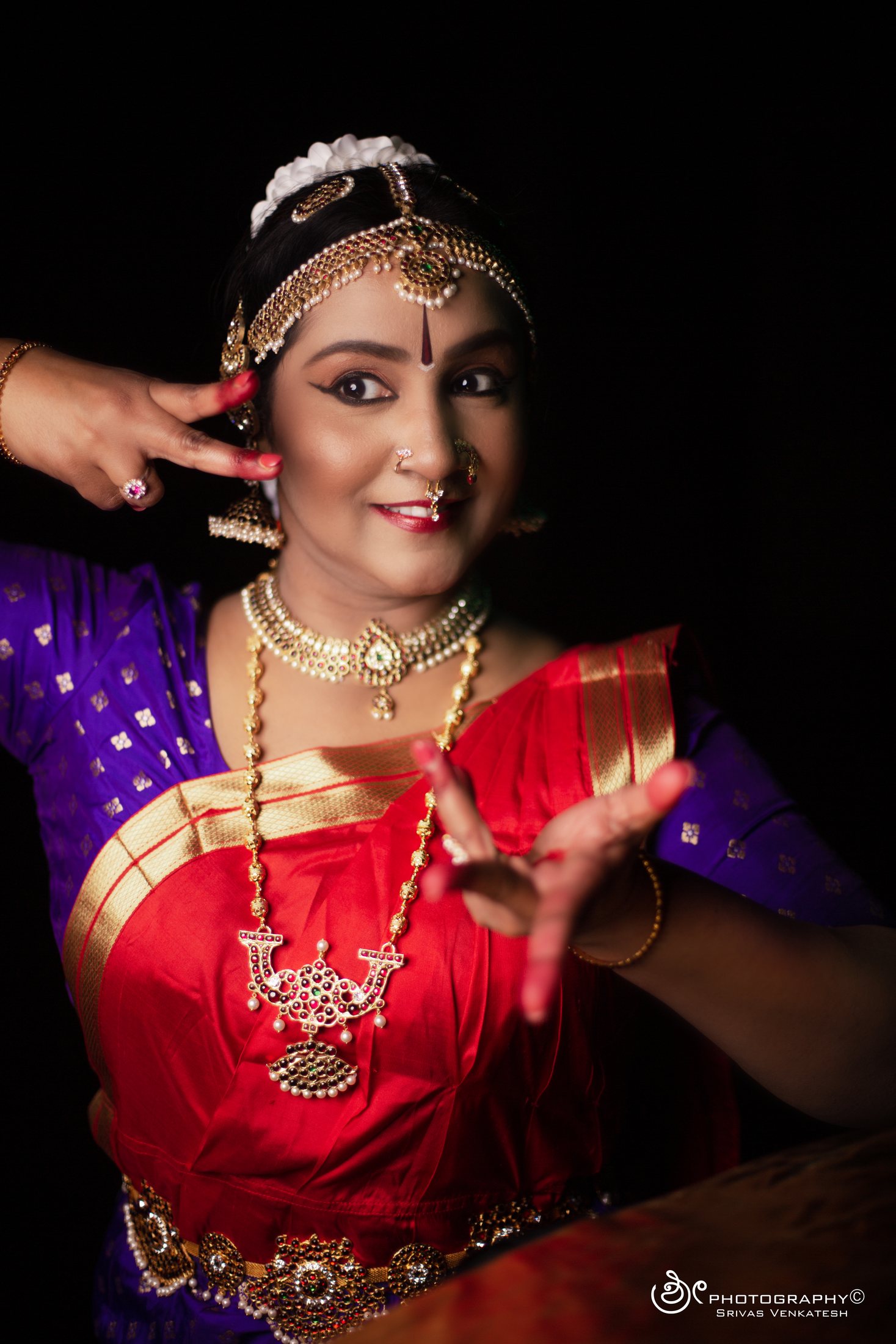 Classical dancer extending an expressive hand gesture